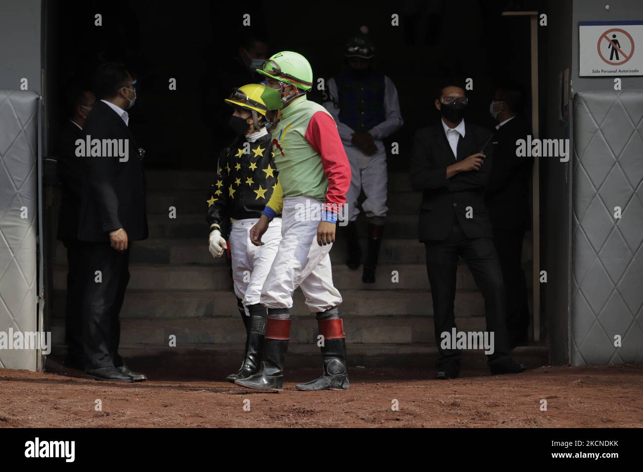 Jockeys at the Hipódromo de las Americas in Mexico City, prior to a race on the occasion of the LXXVI Handicap of the Americas 2021 during the COVID-19 health emergency and the yellow epidemiological traffic light in the capital. (Photo by Gerardo Vieyra/NurPhoto) Stock Photo