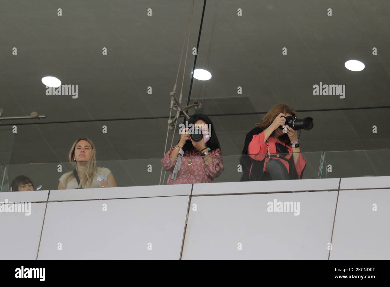 Three photographers in the box area of the Hipódromo de las Americas in Mexico City, on the occasion of the LXXVI Handicap of the Americas 2021 during the COVID-19 health emergency and the yellow epidemiological traffic light in the capital. (Photo by Gerardo Vieyra/NurPhoto) Stock Photo