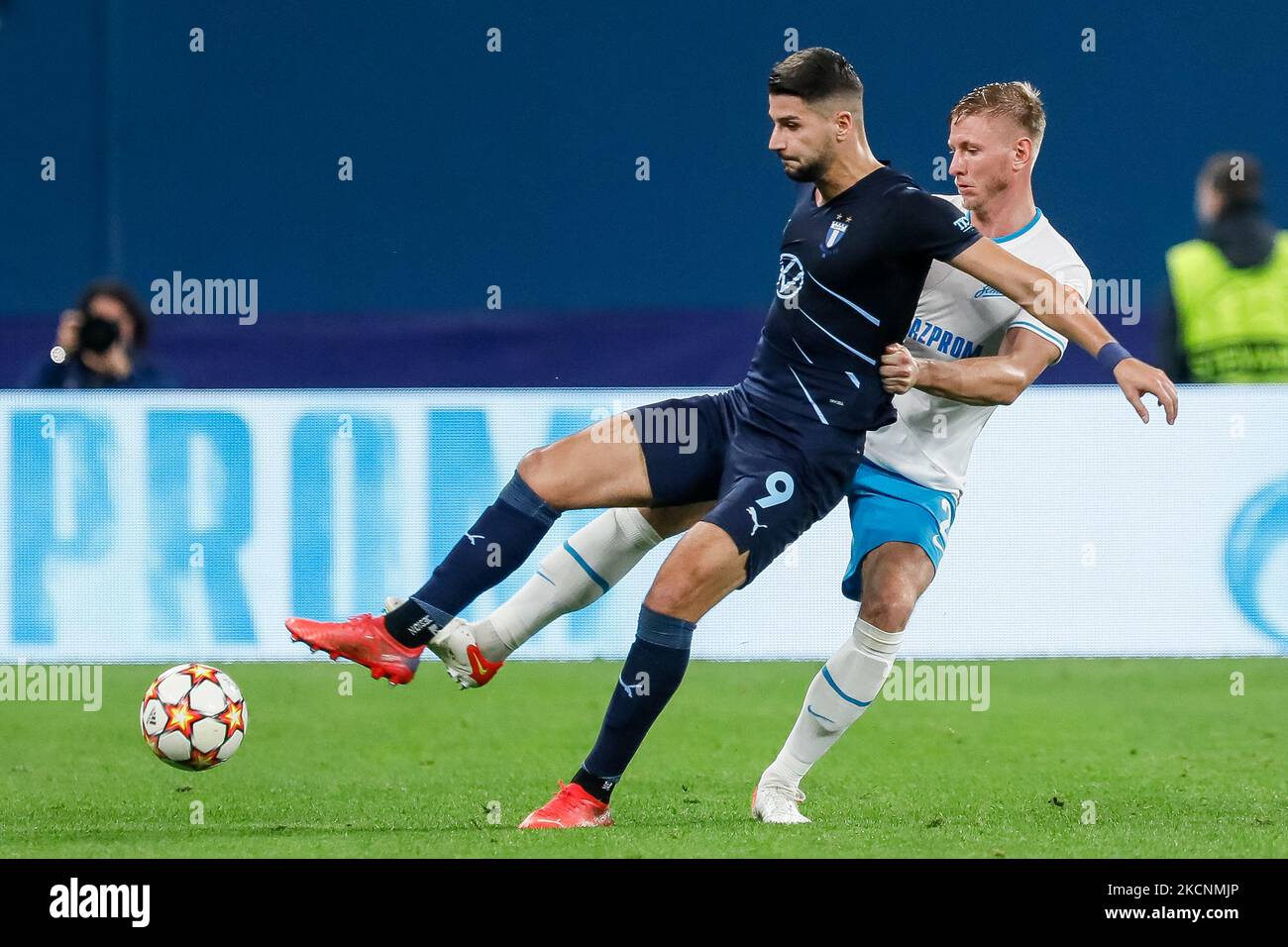 Dmitri Chistyakov (R) of Zenit and Antonio Colak of Malmo vie for the ball during the UEFA Champions League Group H match between Zenit St. Petersburg and Malmo FF on September 29, 2021 at Gazprom Arena in Saint Petersburg, Russia. (Photo by Mike Kireev/NurPhoto) Stock Photo