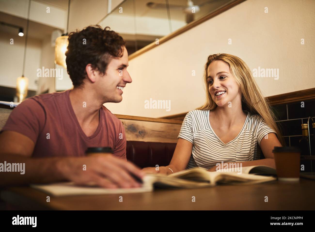 Someones falling for her tutor. two happy young students having a study ...