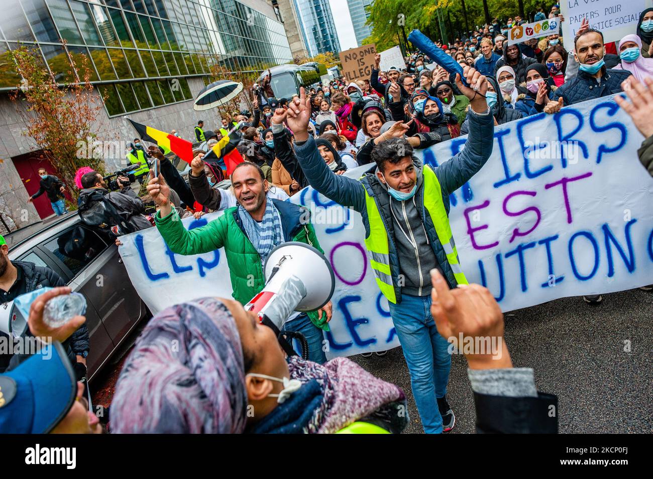 People are dancing and jumping with music from Middle East, during 'We are Belgium too' demonstration organized in Brussels, on October 3rd, 2021. (Photo by Romy Arroyo Fernandez/NurPhoto) Stock Photo
