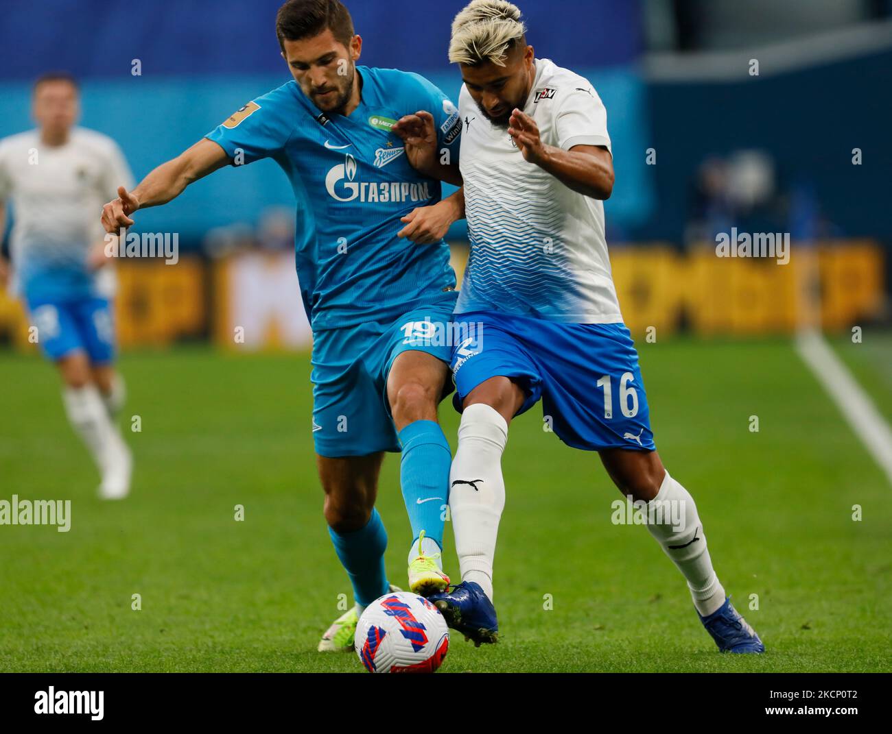 Aleksei Sutormin (L) of Zenit and Christian Noboa of Sochi vie for the ball during the Russian Premier League match between FC Zenit Saint Petersburg and FC Sochi on October 3, 2021 at Gazprom Arena in Saint Petersburg, Russia. (Photo by Mike Kireev/NurPhoto) Stock Photo