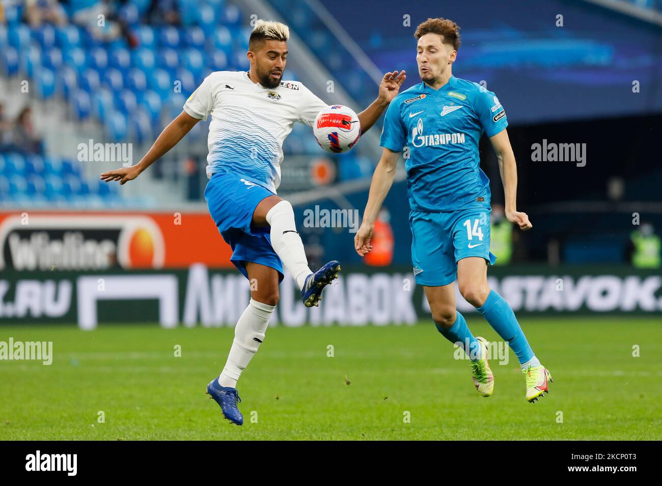 Daler Kuzyaev (R) of Zenit and Christian Noboa of Sochi in action during the Russian Premier League match between FC Zenit Saint Petersburg and FC Sochi on October 3, 2021 at Gazprom Arena in Saint Petersburg, Russia. (Photo by Mike Kireev/NurPhoto) Stock Photo