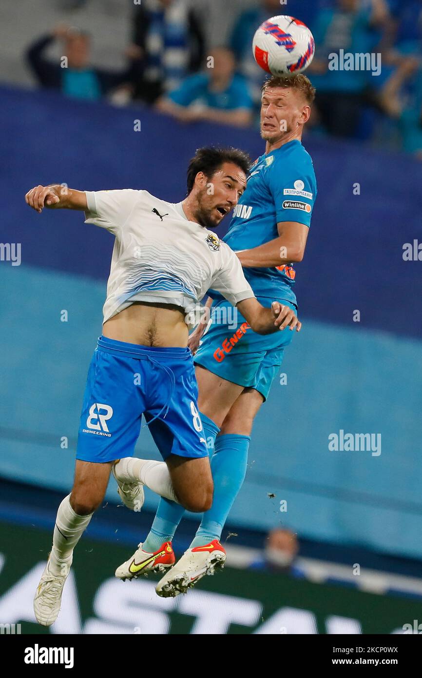 Dmitri Chistyakov (R) of Zenit and Ivelin Popov of Sochi vie for a header during the Russian Premier League match between FC Zenit Saint Petersburg and FC Sochi on October 3, 2021 at Gazprom Arena in Saint Petersburg, Russia. (Photo by Mike Kireev/NurPhoto) Stock Photo