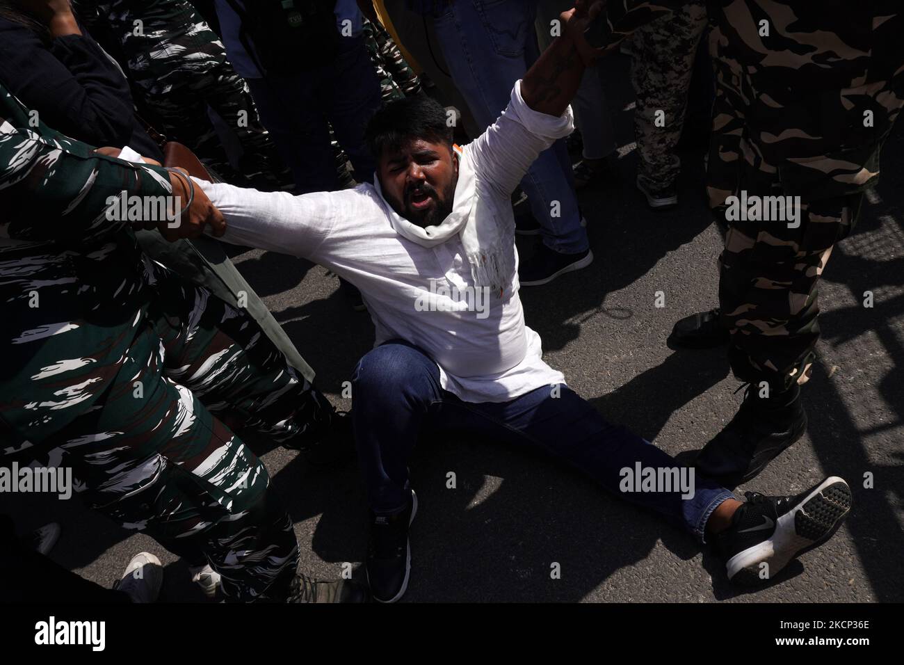 Paramilitary personnel detain an activist of the Indian Youth Congress (IYC) party as he takes part in a protest against killing of four farmers in Uttar Pradesh' Lakhimpur Kheri after being run over by a car owned by India's Union Minister of State, in New Delhi, India on October 4, 2021. (Photo by Mayank Makhija/NurPhoto) Stock Photo