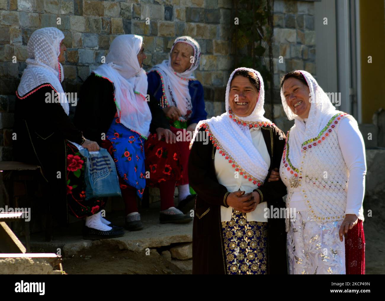 Women wear traditional pomak clothing during traditional circumcision