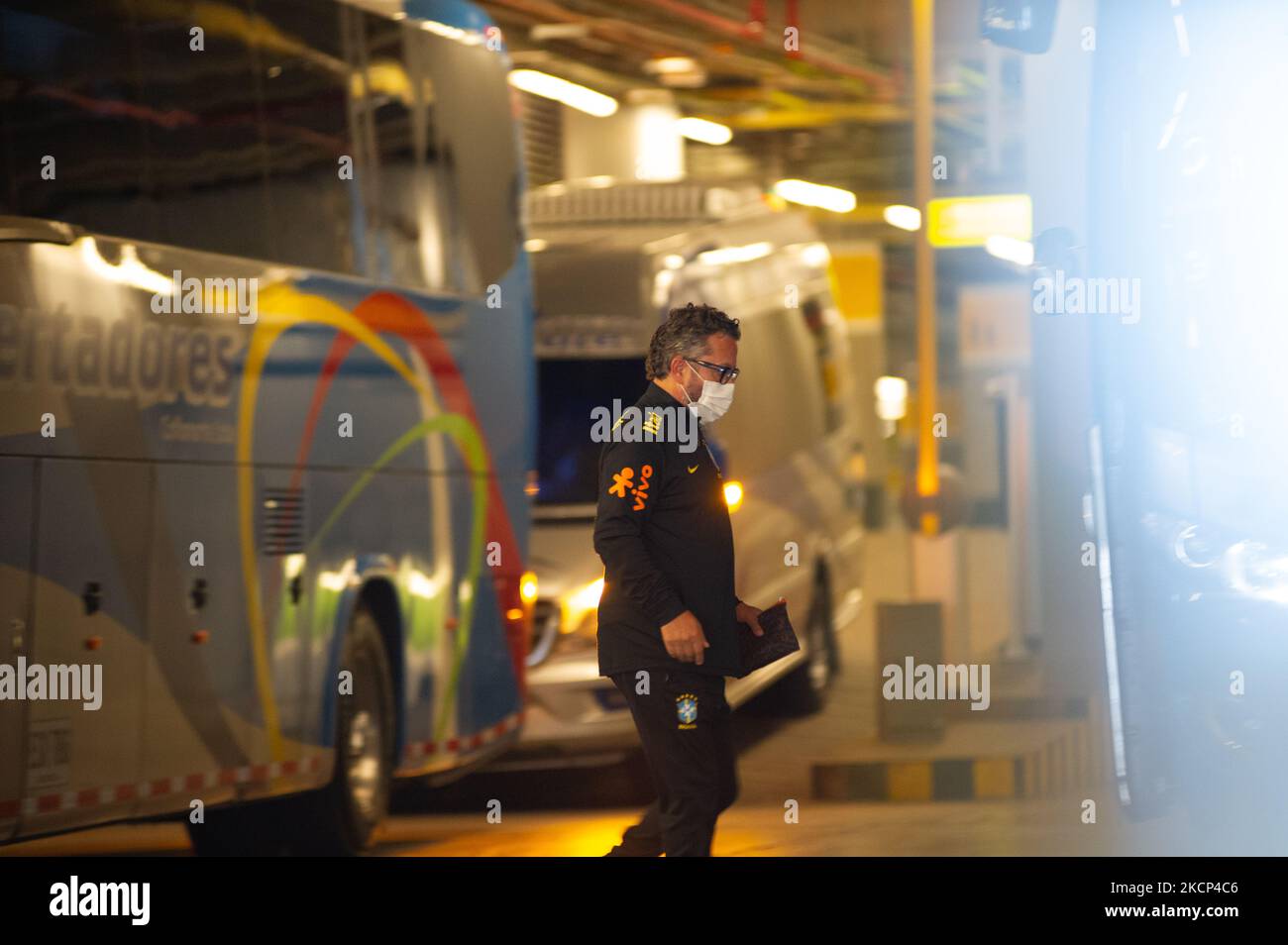 A member of Brazil's national team tecnical comission boards a bus as members of the Brazil federation of football team board their bus at the Grand Hyatt Hotel in Bogota, Colombia to be transported to the Techo stadium for practice against the qualifying matches between Venezuela and Colombia, on October 4, 2021. (Photo by Sebastian Barros/NurPhoto) Stock Photo