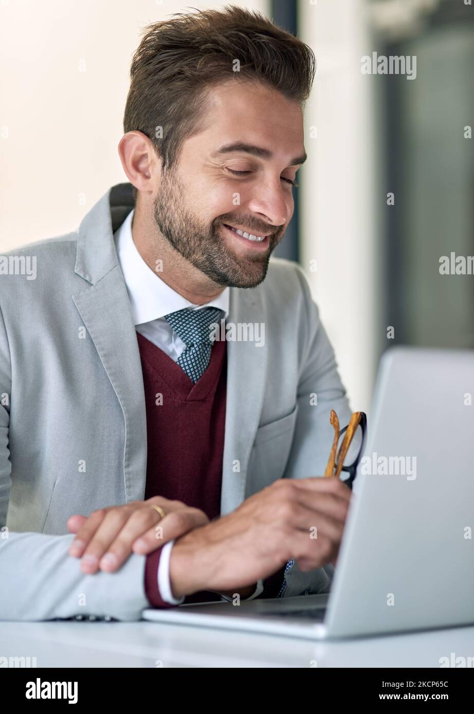 Working his ambitious dream. a businessman using a laptop at his office desk. Stock Photo
