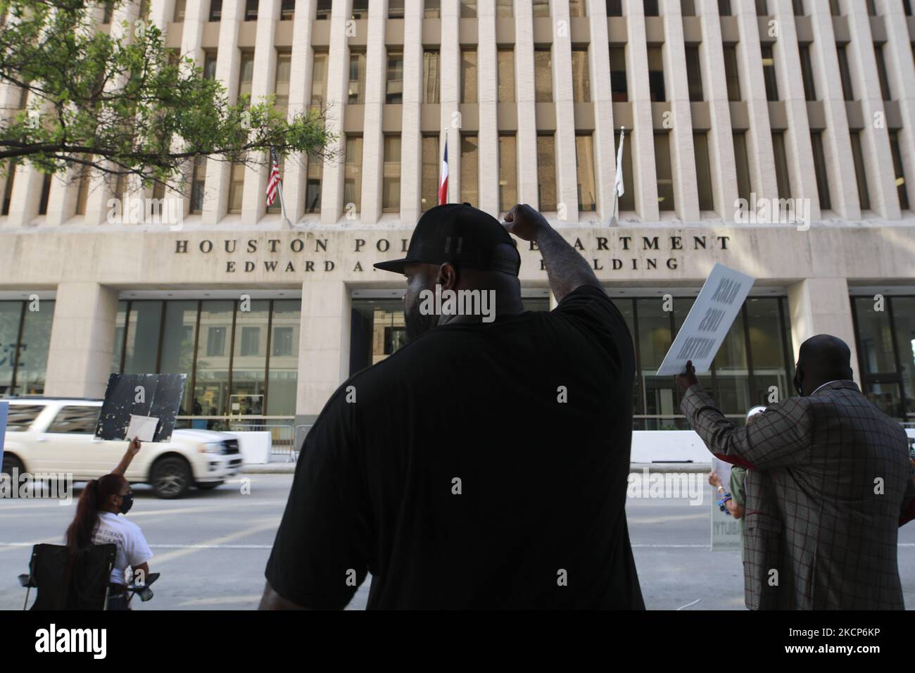 Houston Police Riot Protestors stand in front of the Houston Police Department headquarters ...