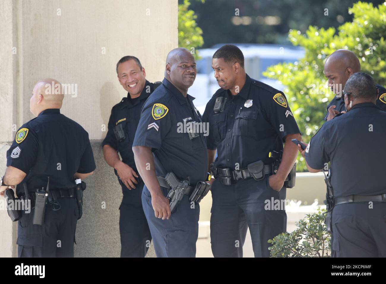 The police watch from across the street at the Houston Police ...
