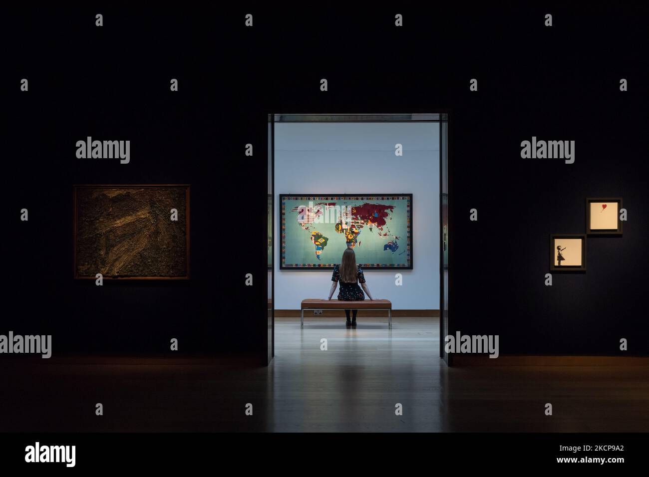 LONDON, UNITED KINGDOM - OCTOBER 08, 2021: A staff member looks at an artwork by Alighiero Boetti (1940-1994) 'Mappa', 1988-89, estimate: £ 1,200,000 - 1,800,000 during a press preview of 20th/21st Century: Evening Sale at Christie's auction house on October 08, 2021 in London, England. (Photo by WIktor Szymanowicz/NurPhoto) Stock Photo