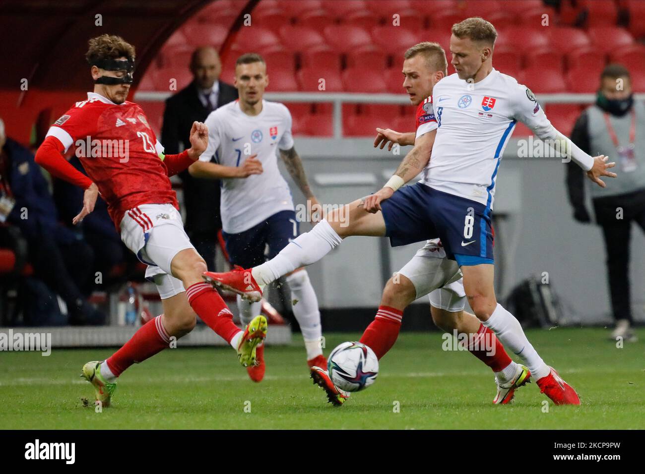 Daler Kuzyaev (L) and Dmitri Barinov of Russia vie for the ball with Ondrej Duda (R) of Slovakia during the FIFA World Cup Qatar 2022 Group H european qualification football match between Russia and Slovakia on October 8, 2021 at Ak Bars Arena in Kazan, Russia. (Photo by Mike Kireev/NurPhoto) Stock Photo
