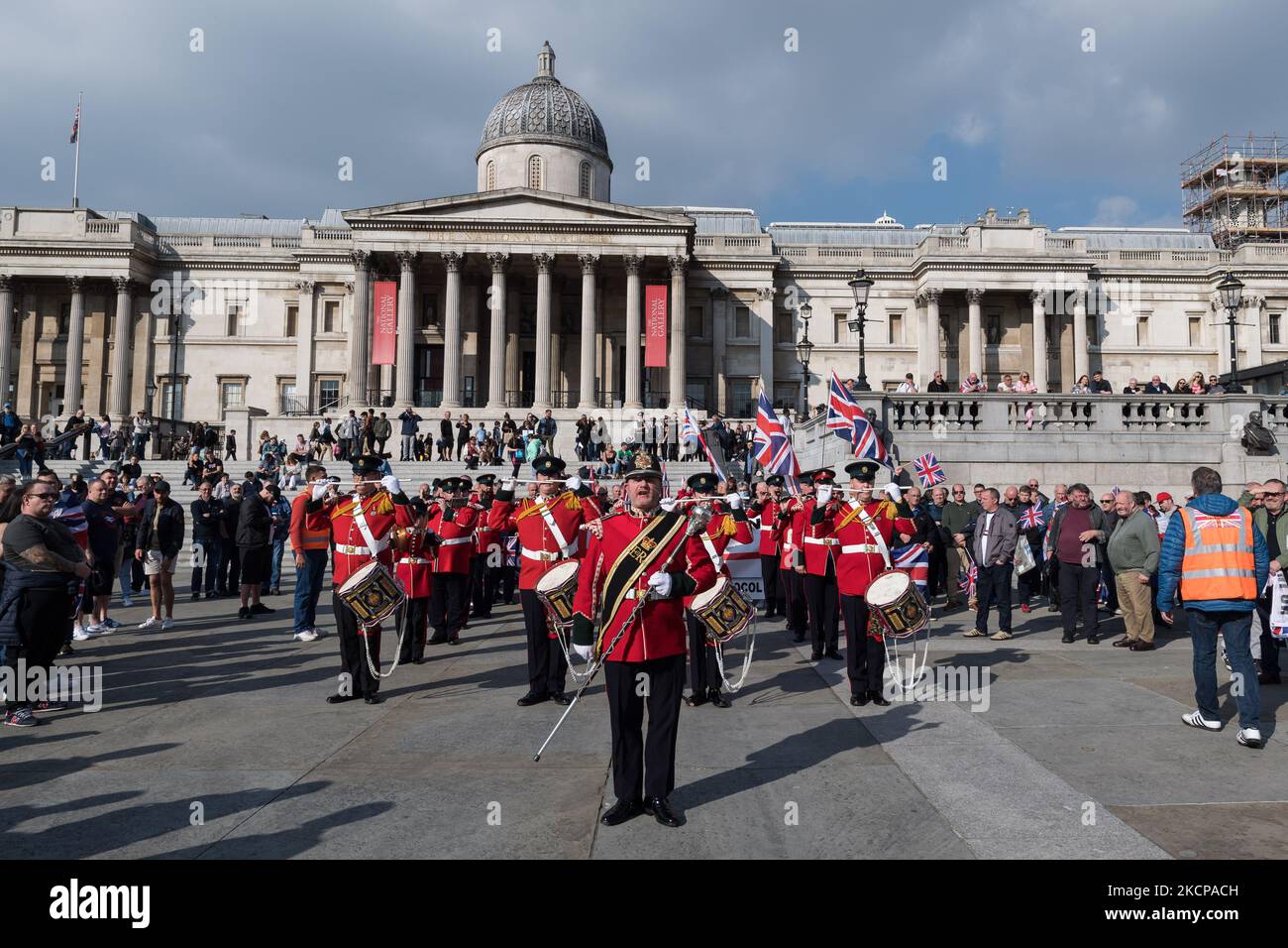 LONDON, UNITED KINGDOM - OCTOBER 09, 2021: Marching band plays as Northern Ireland unionists and loyalists gather in Trafalgar Square before marching to Downing Street in a protest against the Northern Ireland Protocol, which they argue undermines Northern Ireland's position as part of the United Kingdom by creating a trade border on the Irish Sea on October 09, 2021 in London, England. Next week, the EU is set to bring forward new proposals for the Northern Ireland Protocol, which was implemented after Brexit to protect the Good Friday agreement by keeping Northern Ireland aligned with the EU Stock Photo
