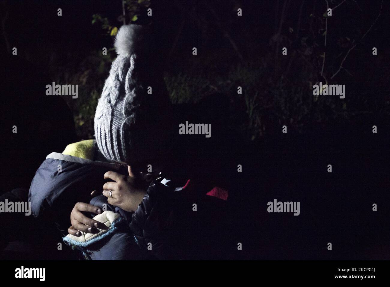 Illegal immigrants family after crossing polish belarusian border near Michalowo on October 6, 2021. (Photo by Maciej Luczniewski/NurPhoto) Stock Photo