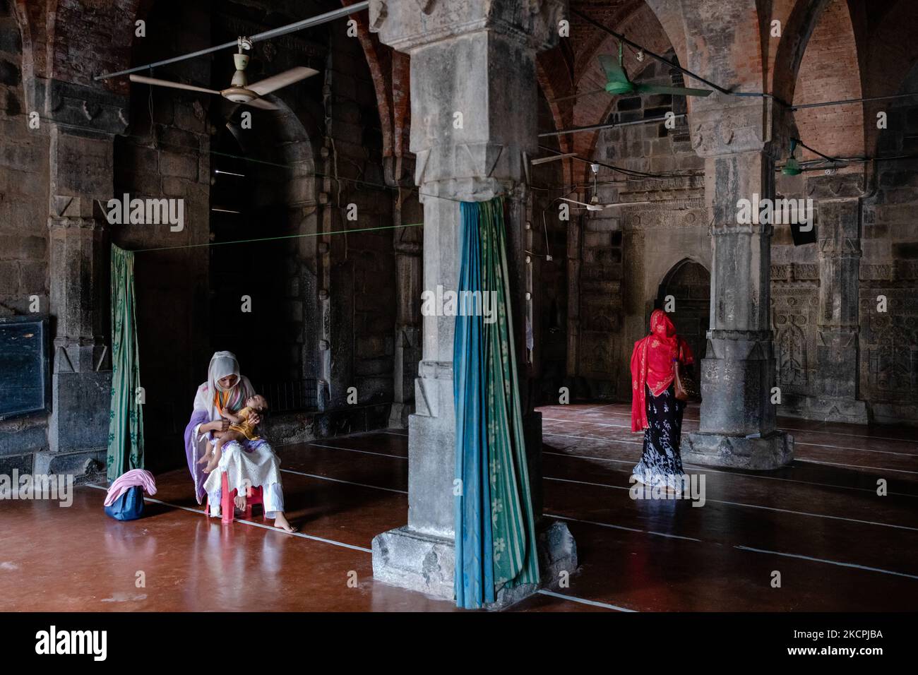 People visit the choto shona mosque in chapainawabganj in Bangladesh. (Photo by Mushfiqul Alam/NurPhoto) Stock Photo