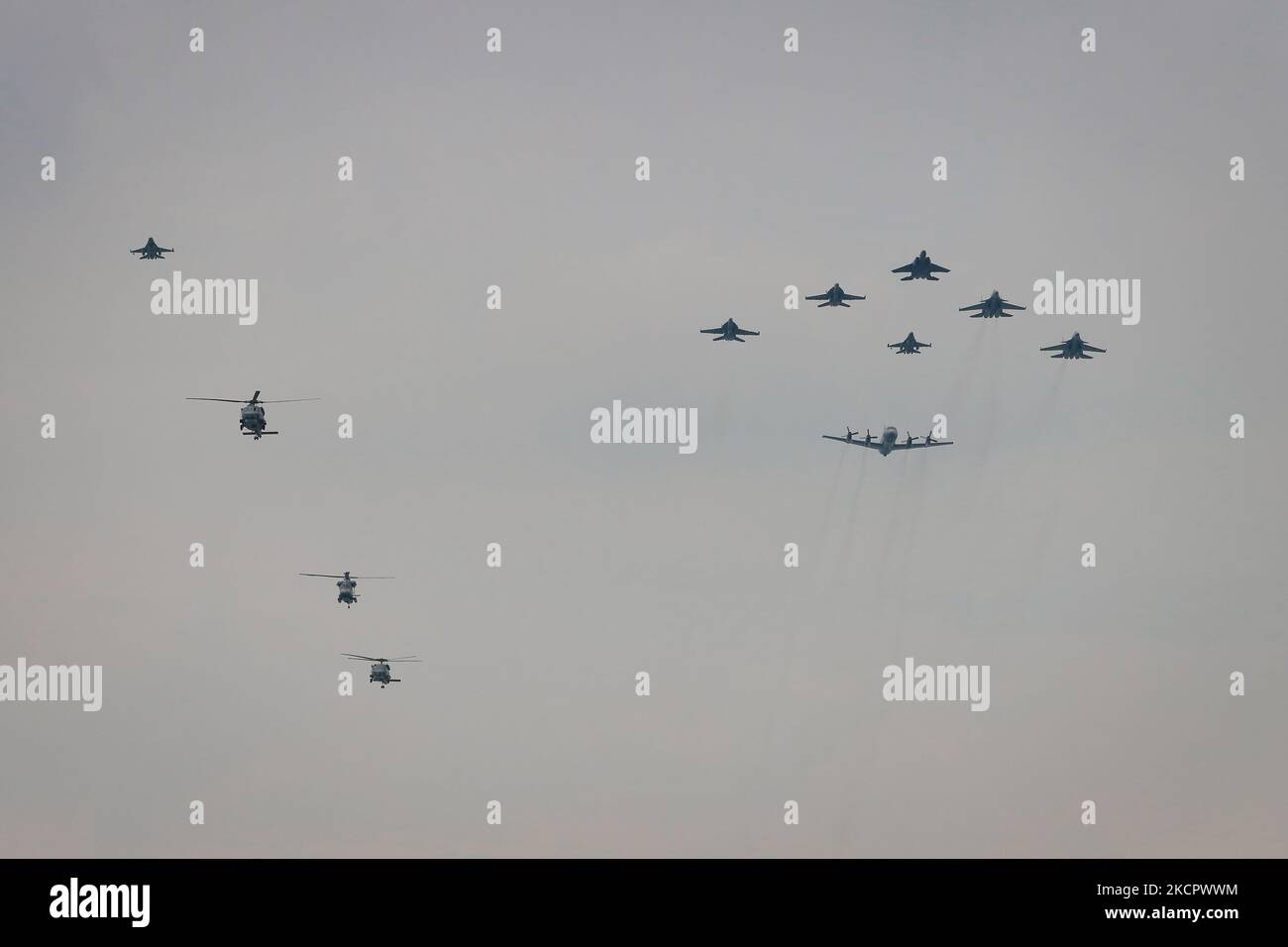 The F-15SG and F-16C/D from the Republic of Singapore Air Force (RSAF), two F/A-18Fs from the Royal Australian Air Force and two SU-30MKMs from the Royal Malaysian Air Force, with a P-3K2 from the Royal New Zealand Air Force (RNZAF) in trail and a helicopter formation comprises two RSAF S-70Bs and an SH-2G(I) from the RNZAF make a flypast on October 18, 2021 in Singapore. The Five Power Defence Arrangements (FPDA) member nations, Singapore, Malaysia, Australia, New Zealand and Britain commemorate the FPDA 50th anniversary with a flypast and a naval vessel display at the conclusion of Exercise  Stock Photo