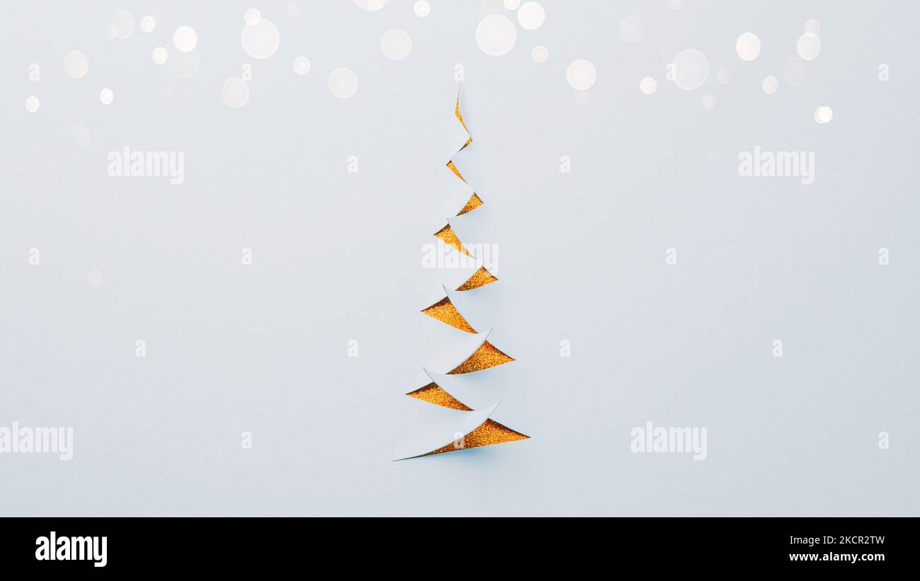 Paper cut Christmas tree with bokeh lights Stock Photo