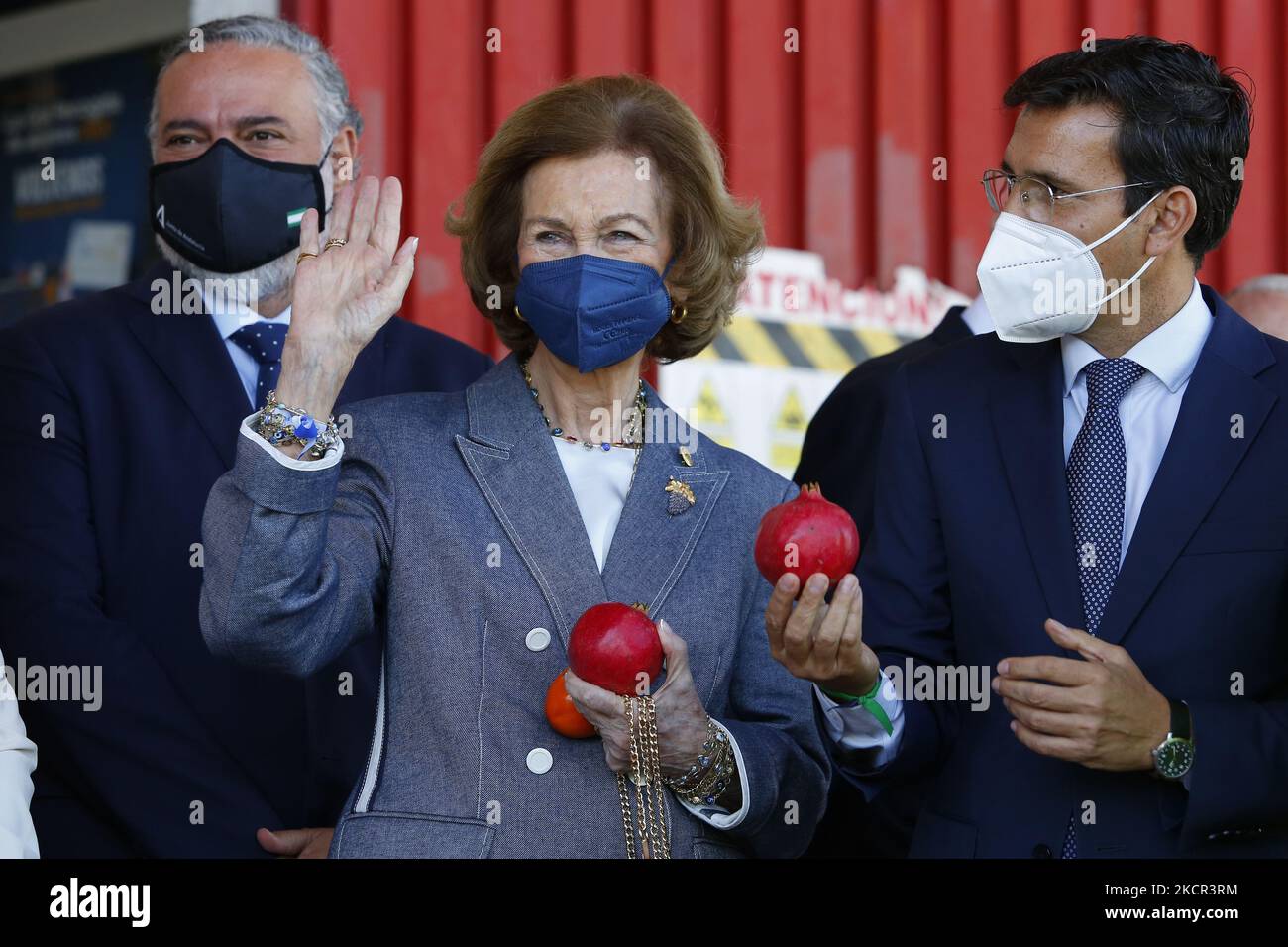 Queen Sofia with a pomegranate in her hand during her visit the Food Bank of Granada on October 20, 2021 in Granada, Spain. (Photo by Álex Cámara/NurPhoto) Stock Photo