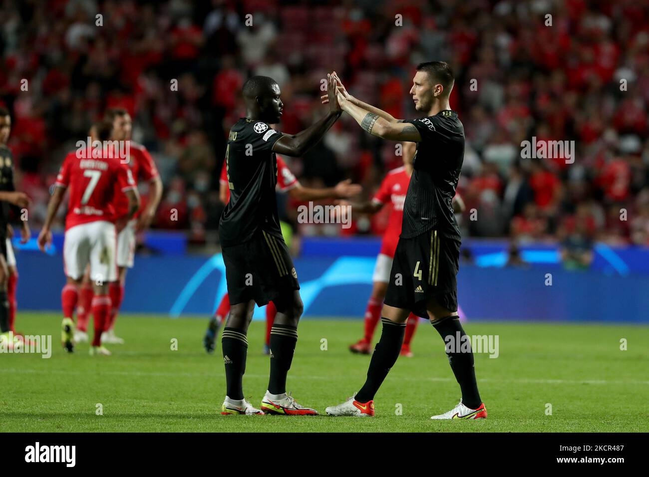 Niklas Sule of Bayern Muenchen (R ) celebrates with Dayot Upamecano during the UEFA Champions League group E football match between SL Benfica and FC Bayern Muenchen at the Luz stadium in Lisbon, Portugal on October 20, 2021. (Photo by Pedro FiÃºza/NurPhoto) Stock Photo