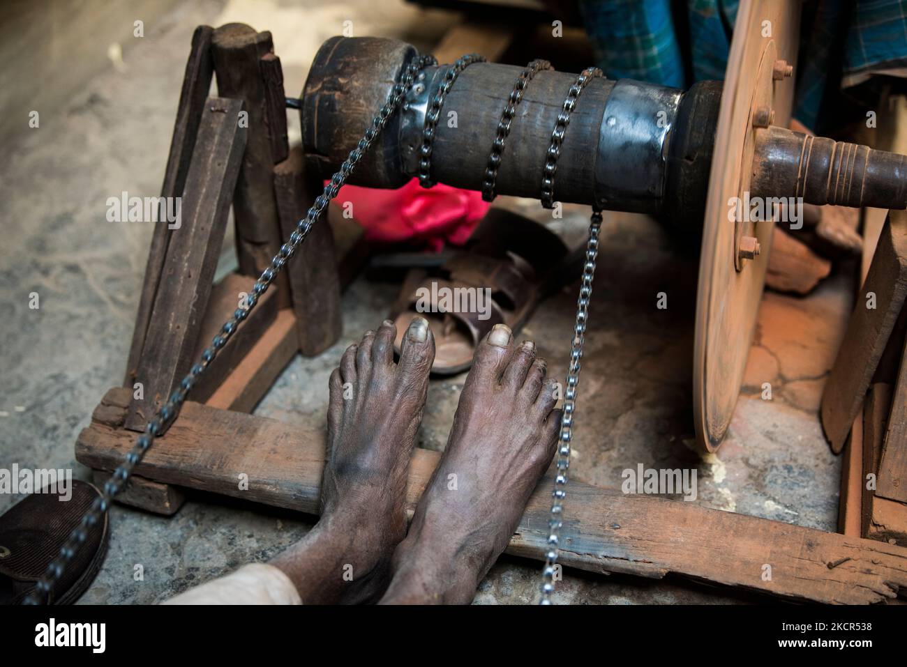 Kathmandu, Nepal- April 20,2019 : Knife sharpeners sharpen knives on the streets of Kathmandu in the traditional way. Stock Photo