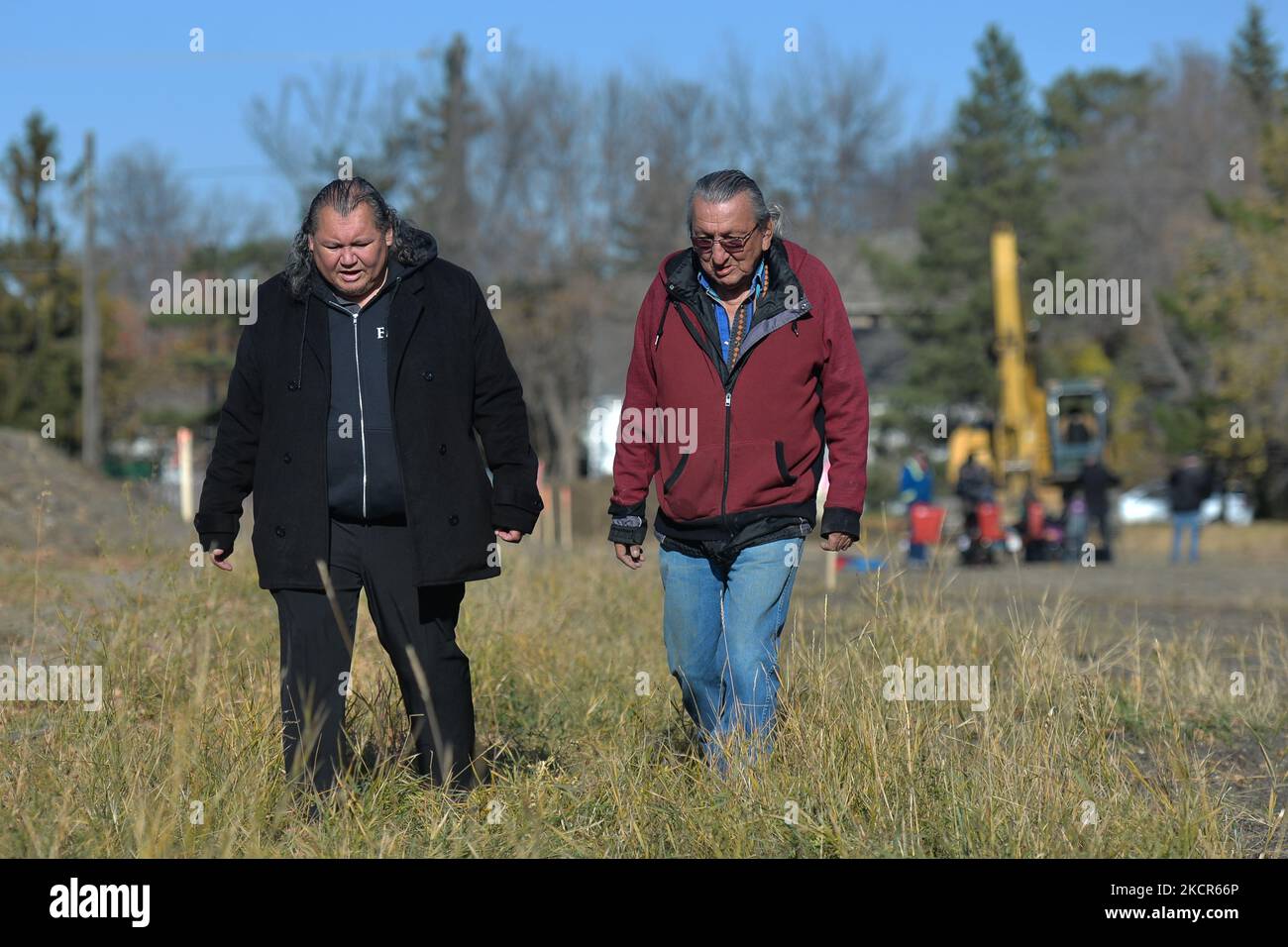 (L-R) Chief Calvin Bruneau of Papaschase First Nation Elder Fernie Marty from the Papaschase First Nation, monitors the excavation work on the grounds of the former Charles Camsell Hospital, in Edmonton. Second phase of excavation work began today at the site of the former Charles Camsell Hospital, the Edmonton facility that for decades was used to treat Indigenous people with tuberculosis. First Nation members have been calling for construction to stop at the grounds where many believe patients may have been buried. The search is being funded by the property's developer. On Thursday, 21 Octob Stock Photo