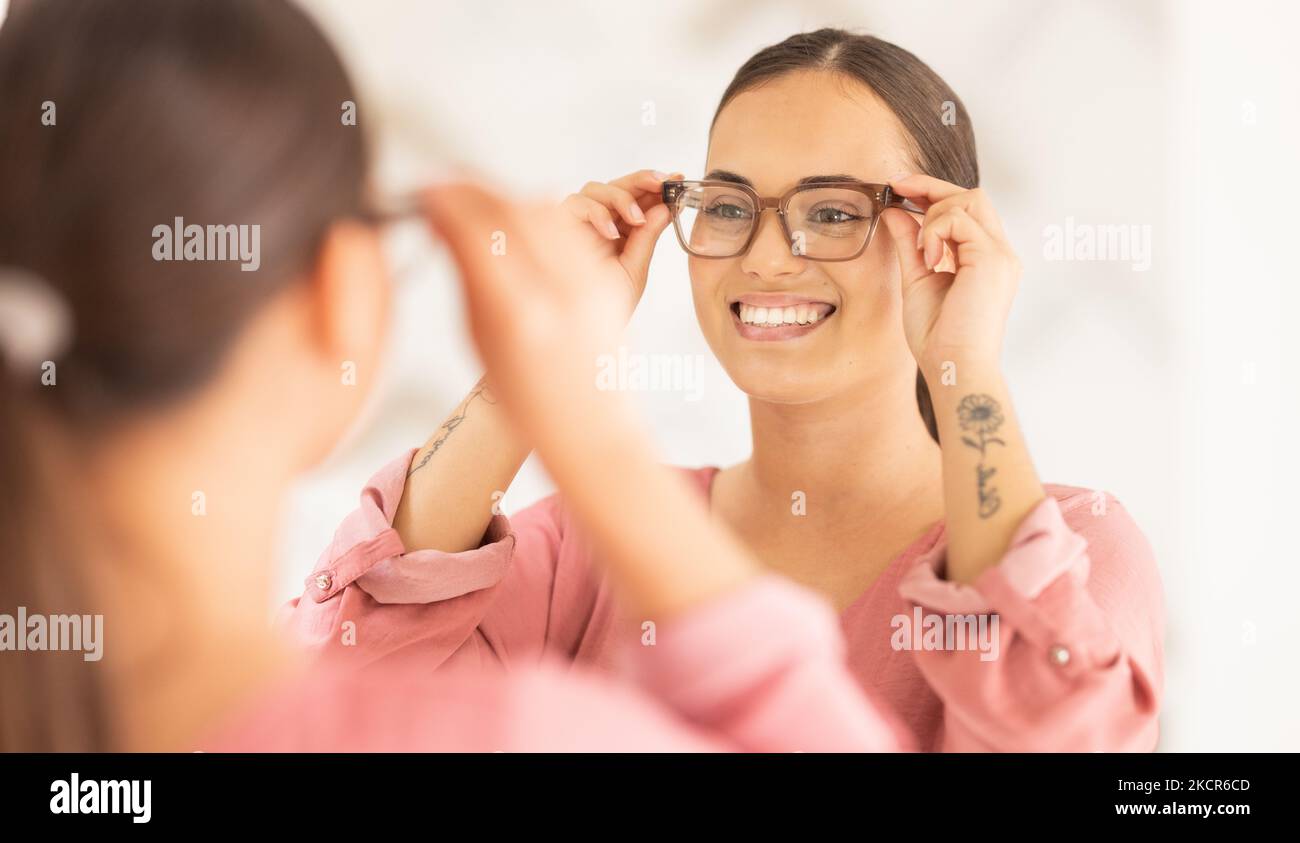 Vision, mirror and happy woman trying on glasses to choose a new frame