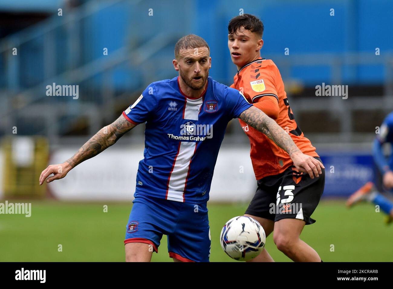 Oldham Athletic's Benny Couto tussles with Lewis Alessandro during the Sky Bet League 2 match between Carlisle United and Oldham Athletic at Brunton Park, Carlisle on Saturday 23rd October 2021. (Photo by Eddie Garvey/MI News/NurPhoto) Stock Photo