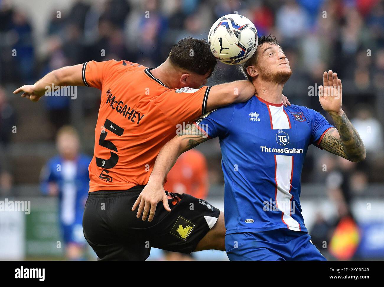 Oldham Athletic's Harrison McGahey tussles with Lewis Alessandra of Carlisle United during the Sky Bet League 2 match between Carlisle United and Oldham Athletic at Brunton Park, Carlisle on Saturday 23rd October 2021. (Photo by Eddie Garvey/MI News/NurPhoto) Stock Photo