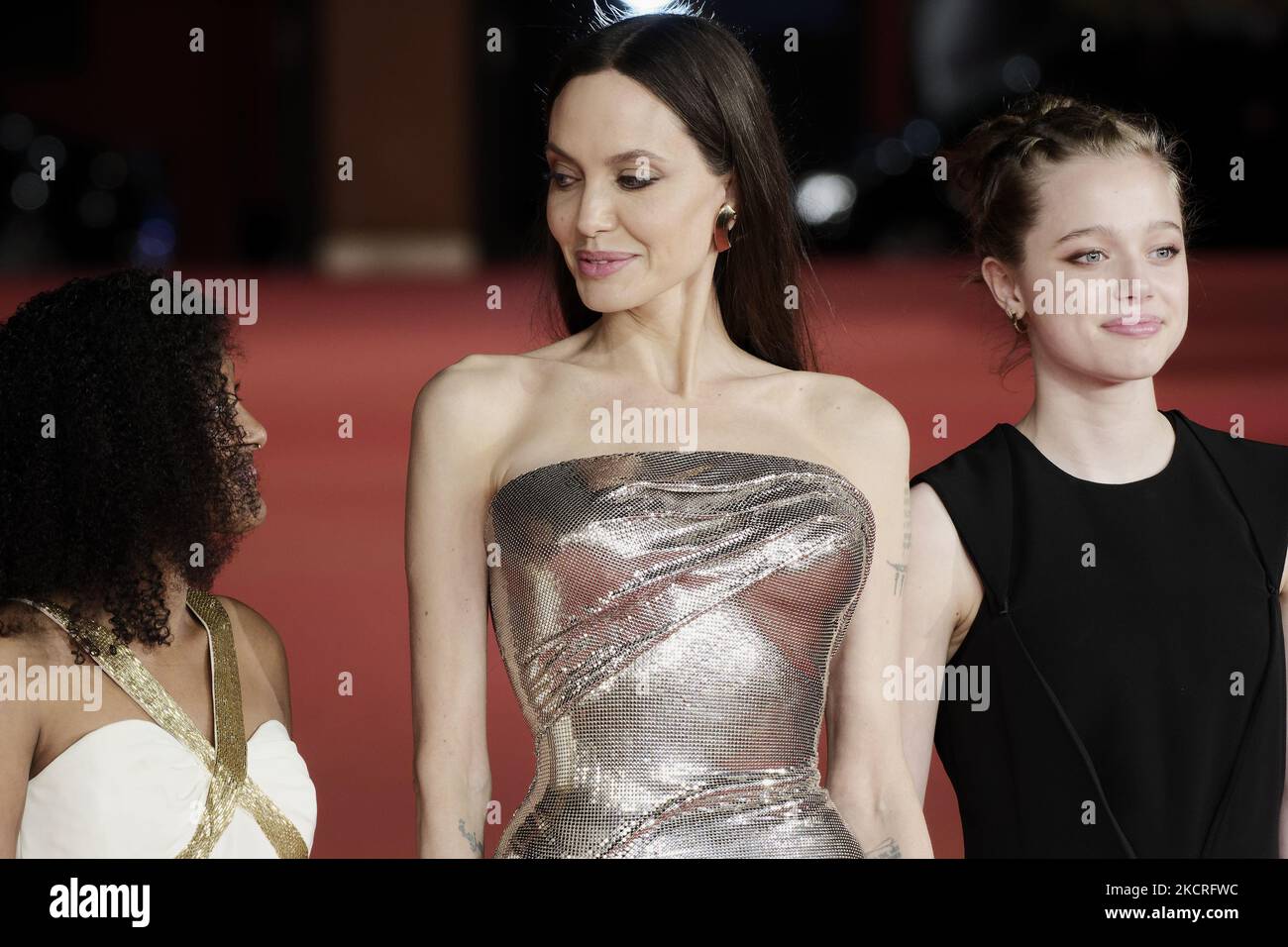 (L-R) Zahara Marley Jolie-Pitt, Angelina Jolie and Shiloh Jolie-Pitt attend the red carpet of the movie 'Eternals' during the 16th Rome Film Fest 2021 on October 24, 2021 in Rome, Italy. (Photo by Massimo Valicchia/NurPhoto) Stock Photo