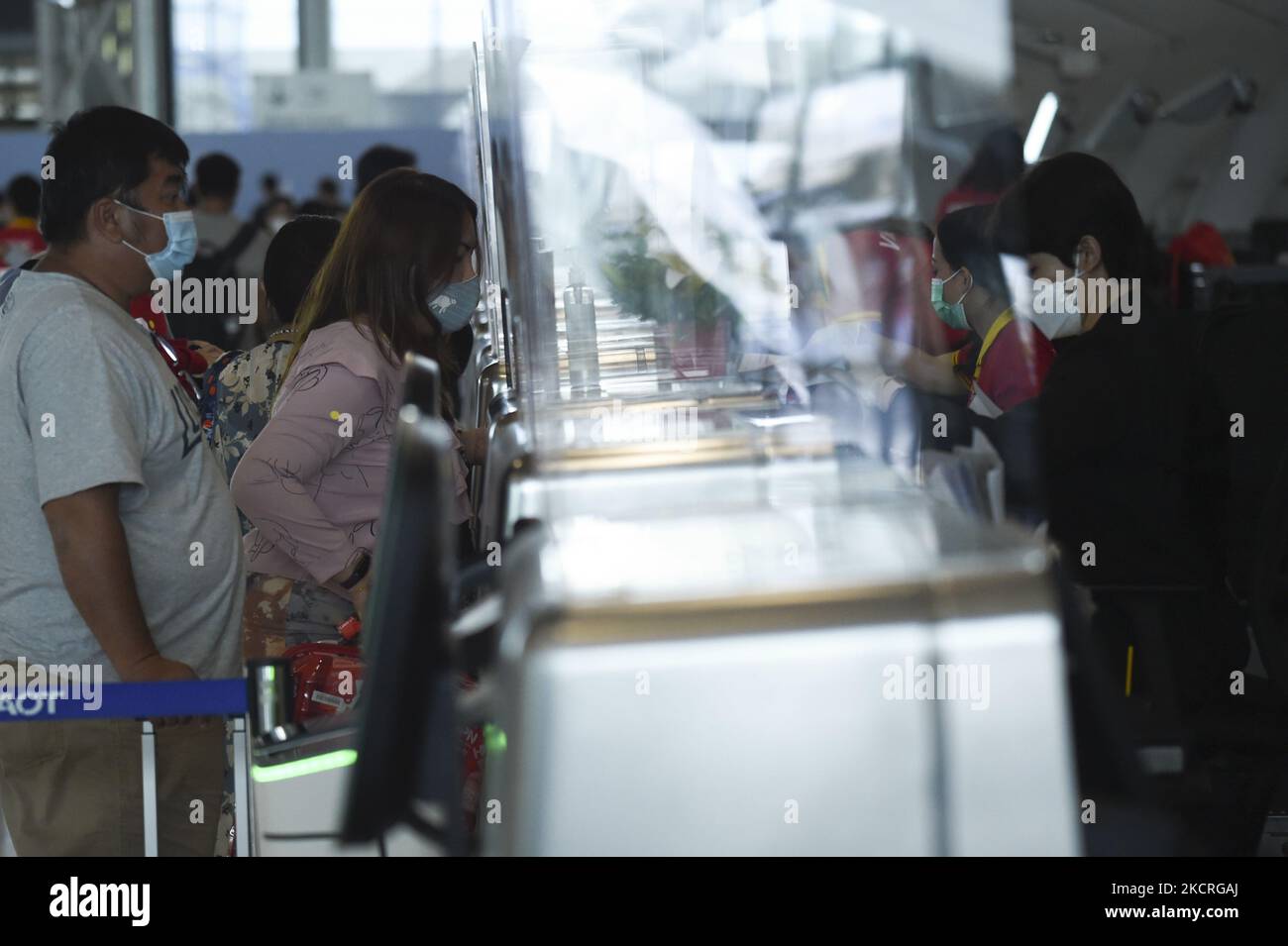 Passengers wear protective masks checkedin at Suvarnabhumi Airport in
