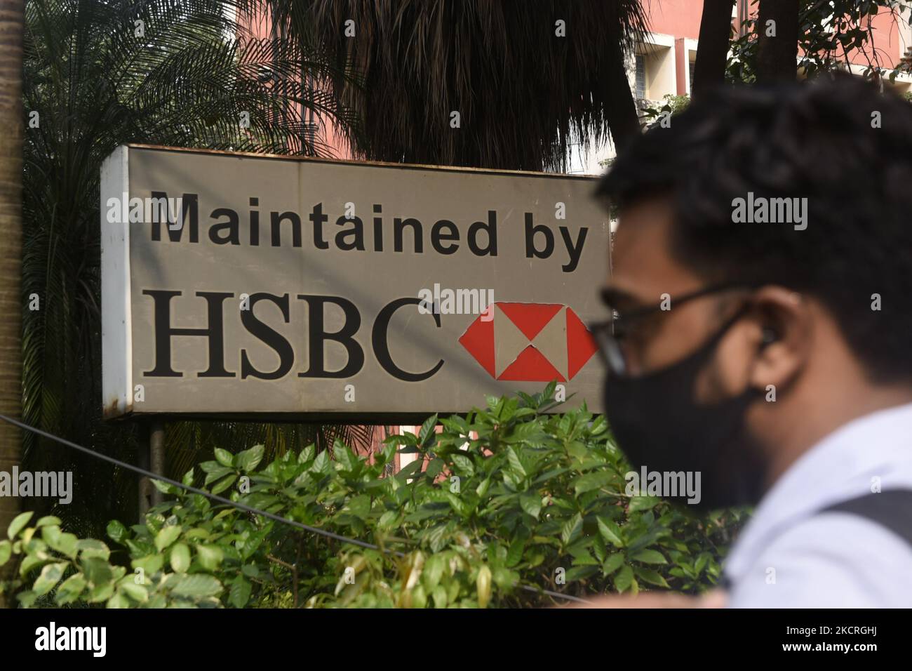 A man crosses HSBC logo in Kolkata, India, 25 October, 2021. HSBC’s profits rose 74% in the third quarter as improving economic conditions allowed the bank to release hundreds of millions of pounds originally set aside for a potential jump in loan defaults during the pandemic according to an Indian media report. (Photo by Indranil Aditya/NurPhoto) Stock Photo