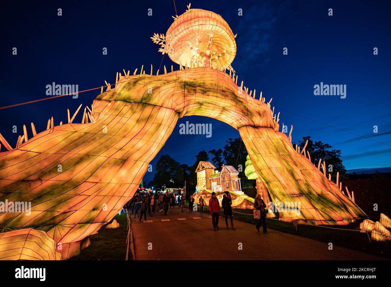 People walk past illuminations at Longleat Festival of Light during the