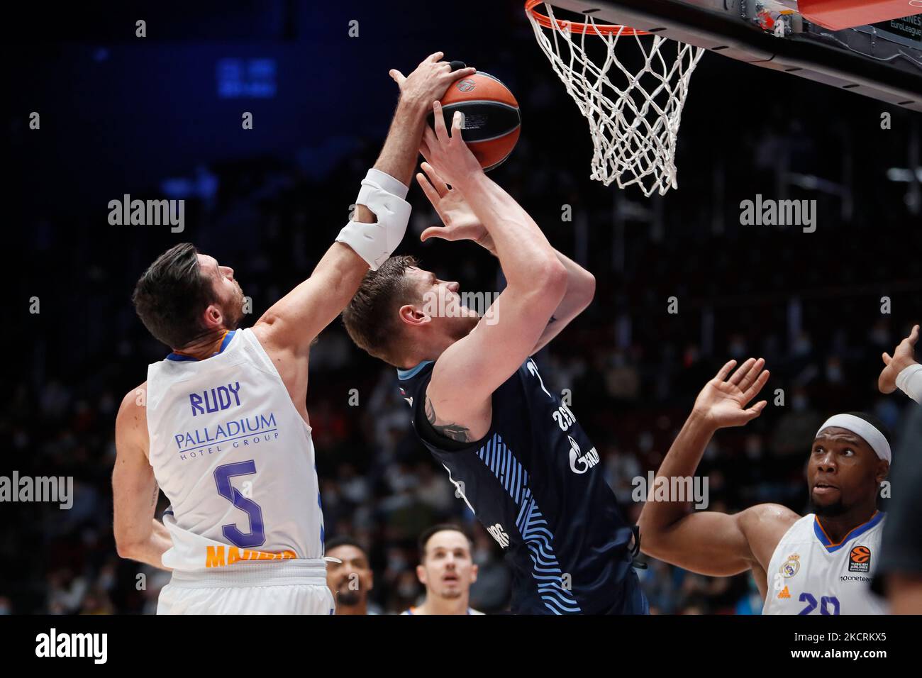 Arturas Gudaitis (C) of Zenit in action against Rudy Fernandez (L) and Guerschon Yabusele (R) of Real Madrid during the EuroLeague Basketball match between Zenit St. Petersburg and Real Madrid on October 27, 2021 at Yubileyny Sports Palace in Saint Petersburg, Russia. (Photo by Mike Kireev/NurPhoto) Stock Photo