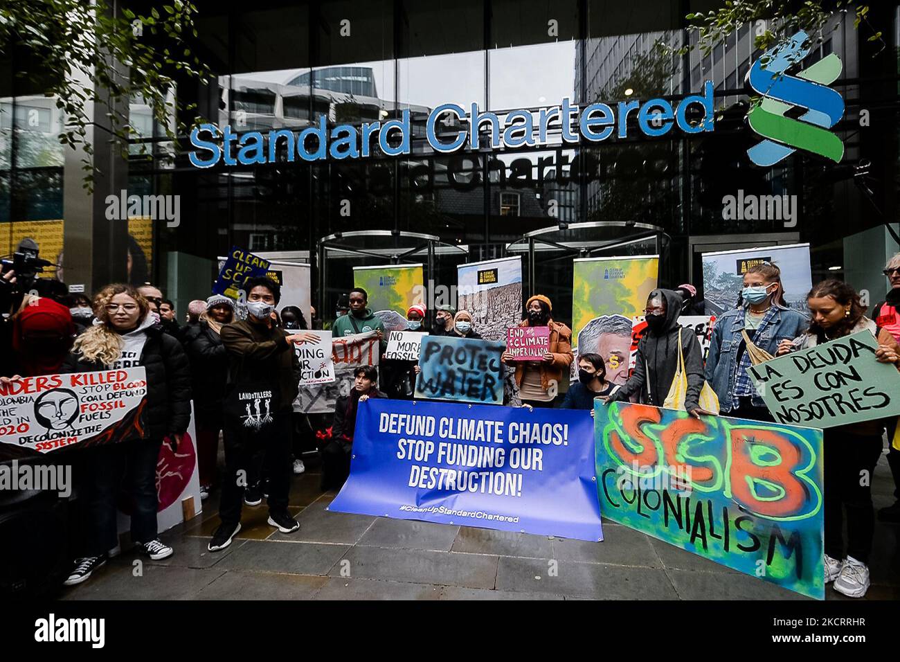 Climate activists protest outside the headquarters of Standard Chartered in London, Britain, 29 October 2021. Climate protesters across the world are demanding that the global financial system stops its financing of fossil fuel companies. According to a report by a coalition of NGOs, the world's biggest banks have paid $3.8 trillion into fossil fuel companies since the 2015 Paris climate agreement. (Photo by Maciek Musialek/NurPhoto) Stock Photo