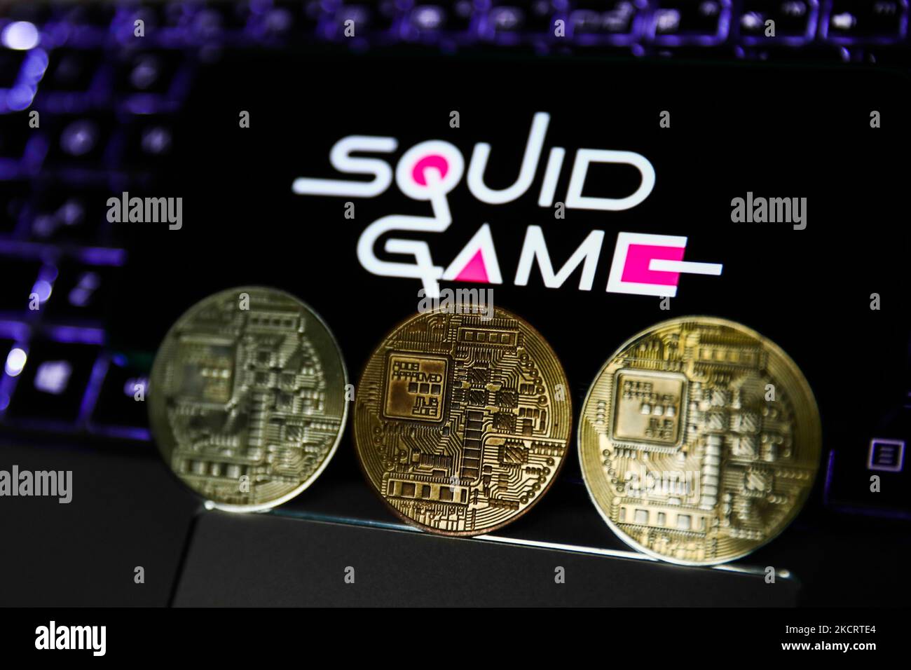 Representation of cryptocurrency and Squid Game logo displayed on a phone  screen are seen in this illustration photo taken in Krakow, Poland on  October 30, 2021. (Photo by Jakub Porzycki/NurPhoto Stock Photo -