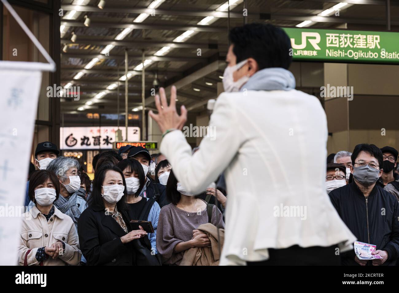 People wearing masks listen to a politician giving a stump speech in Tokyo, 30 Oct. (Photo by Yusuke Harada/NurPhoto) Stock Photo