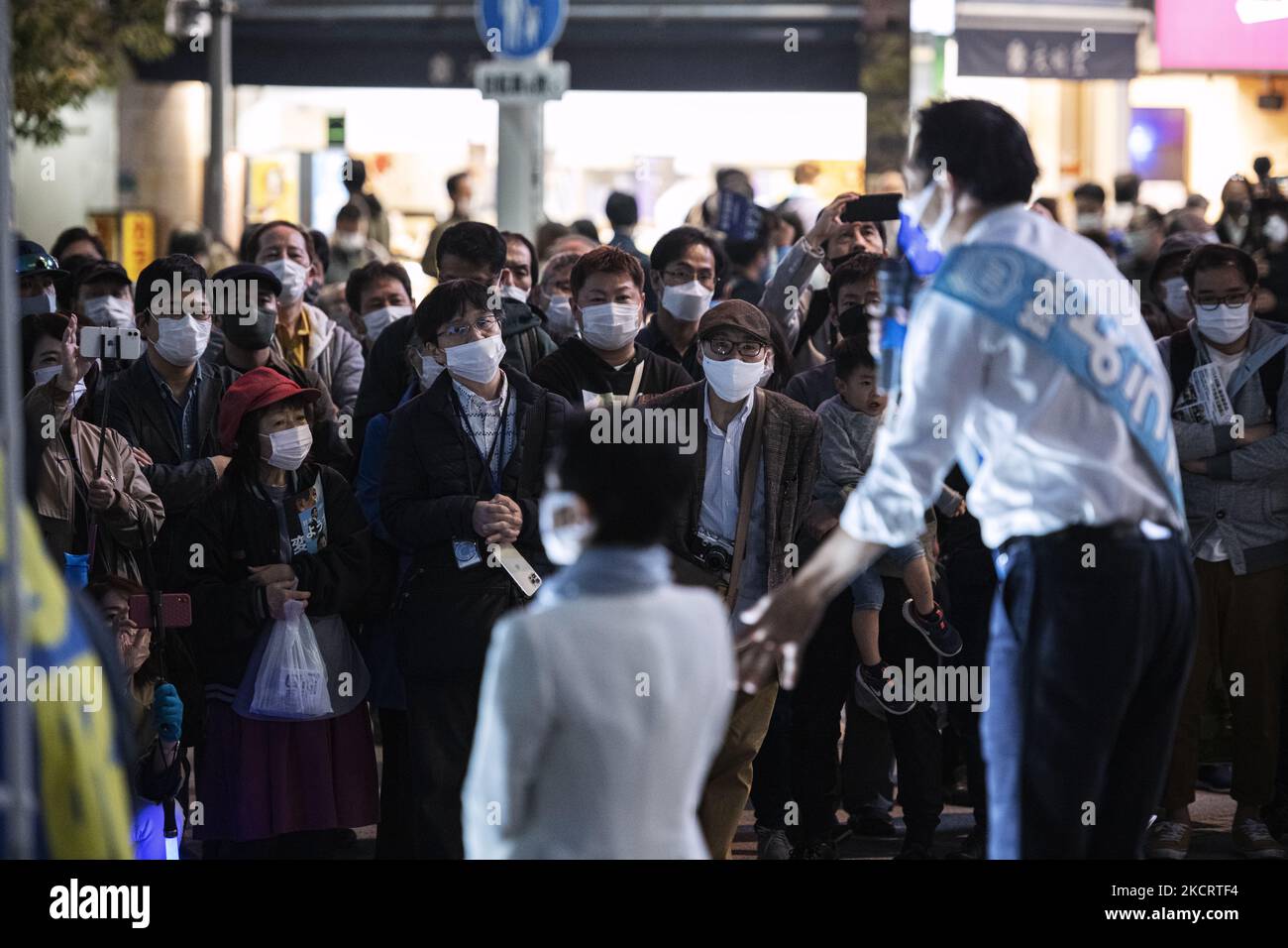 People wearing masks listen to a politician giving a stump speech in Tokyo, 30 Oct. (Photo by Yusuke Harada/NurPhoto) Stock Photo
