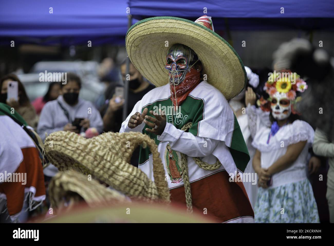 A dance group participates in the Day of the Dead (Dios de los Muertos