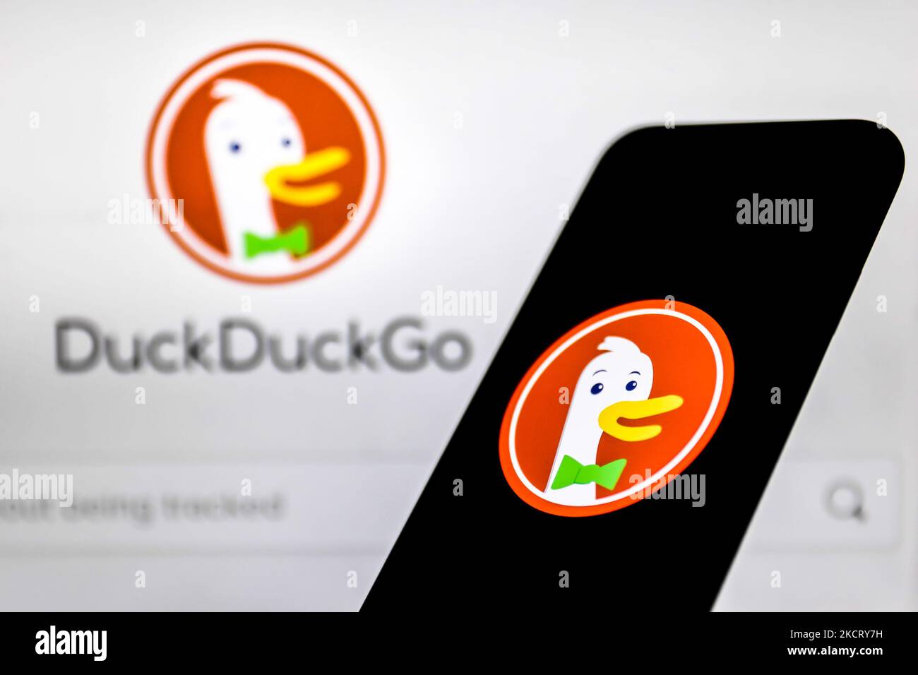 DuckDuckGo logo displayed on a phone screen and DuckDuckGo website