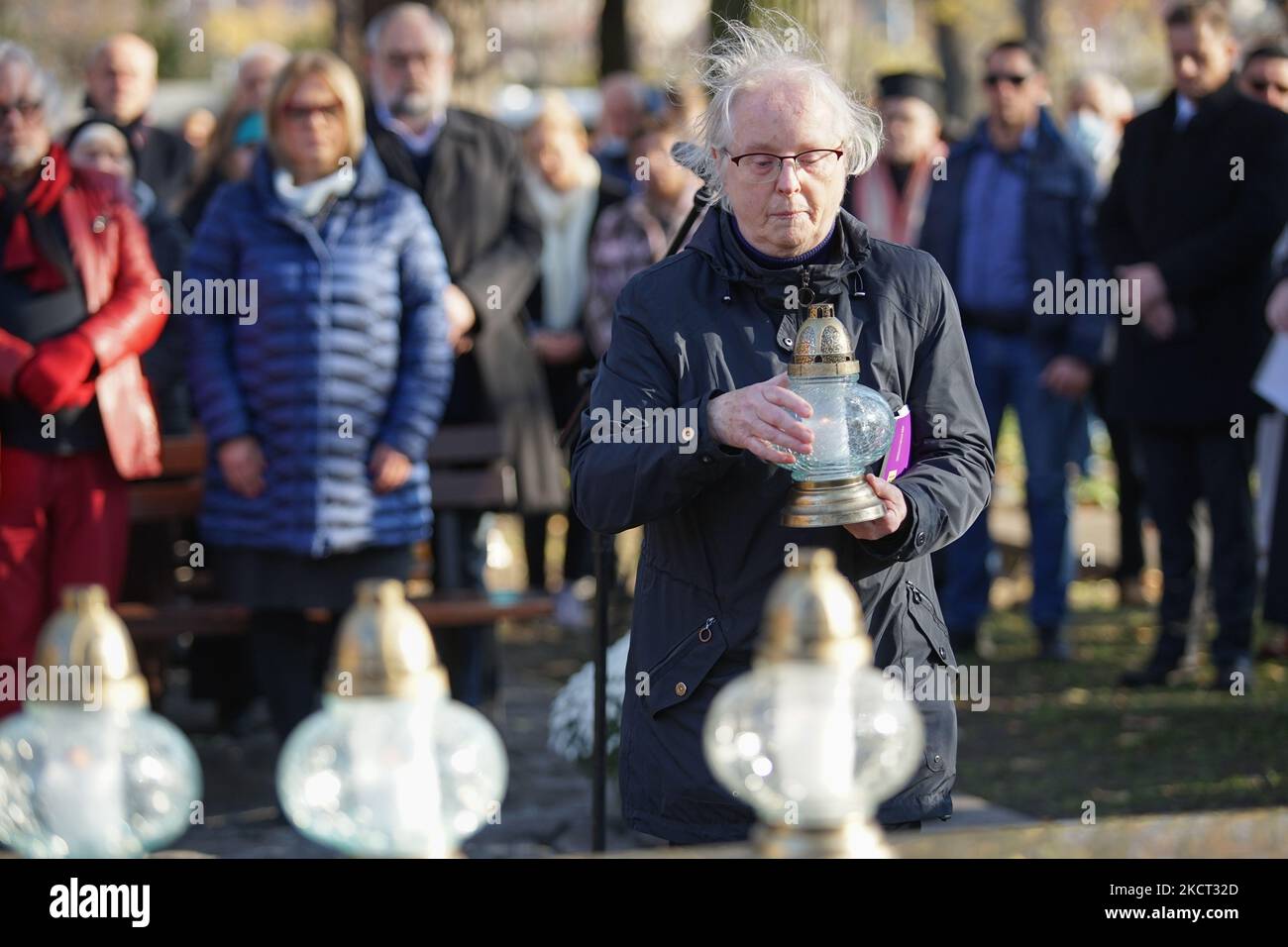 Reader of the Anglican Church Elizabeth Turek during the interfaith ceremony commemorating the dead of various denominations is seen on the Cemetery of Lost Cemeteries in Gdansk, Poland on 1 November 2021 The Cemetery of Lost Cemeteries is a monument that commemorates the necropolis which no longer exists in the city. It is dedicated to the citizens of Gdansk who were once buried in one of the city’s 27 graveyards either destroyed during World War II or bulldozed on purpose after the end of the war. (Photo by Michal Fludra/NurPhoto) Stock Photo