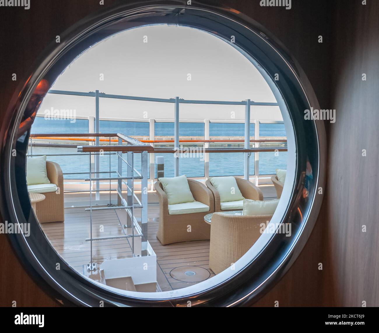 View of an outdoor lounge on the promenade deck of a cruise ship