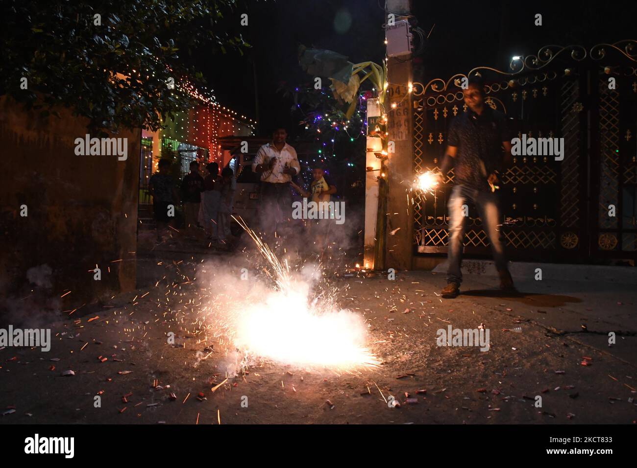 People light fireworks to celebrate Diwali, the Hindu festival of
