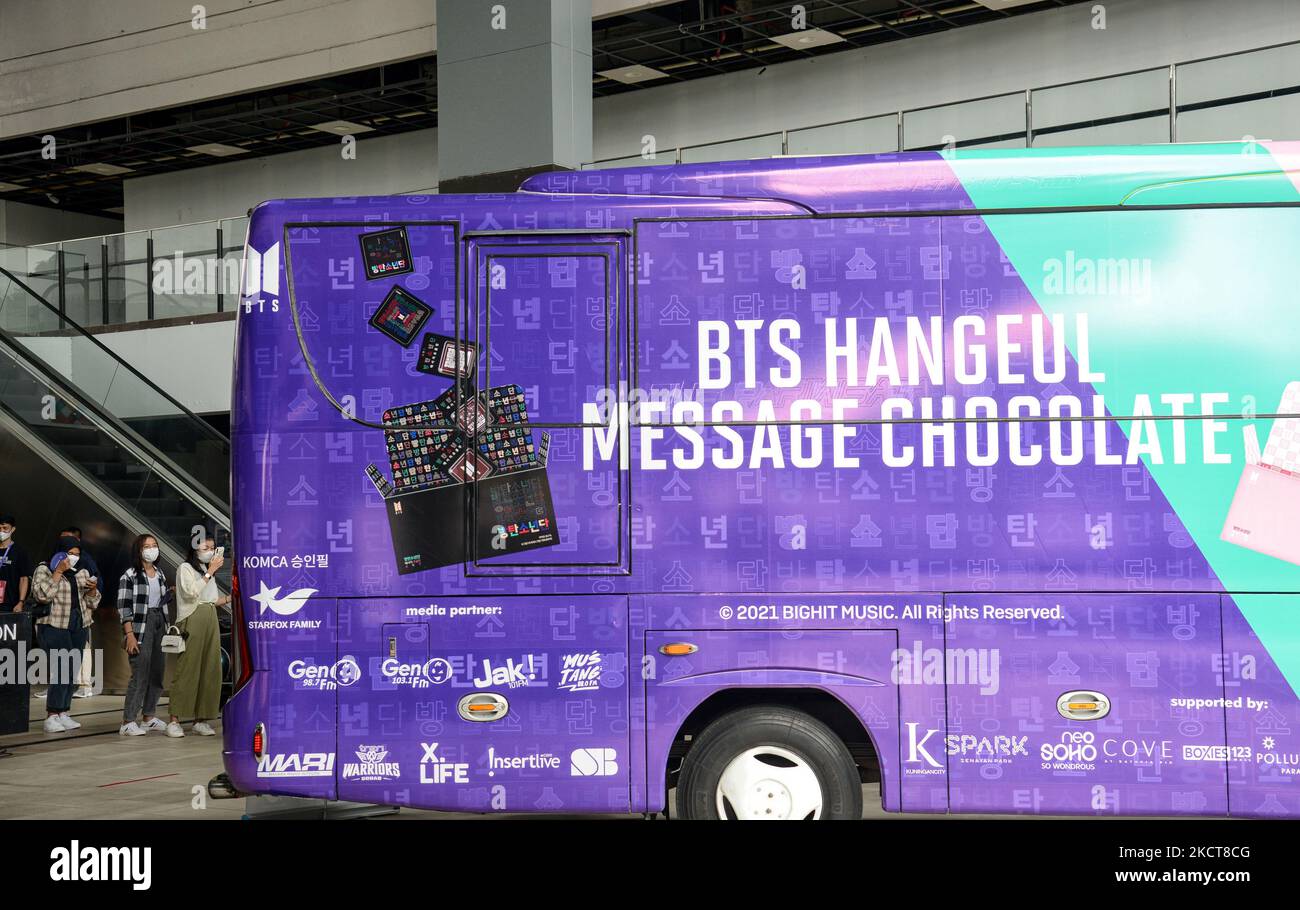 Indonesian fans of South Korean K-pop boy band BTS queue outside a bus ...