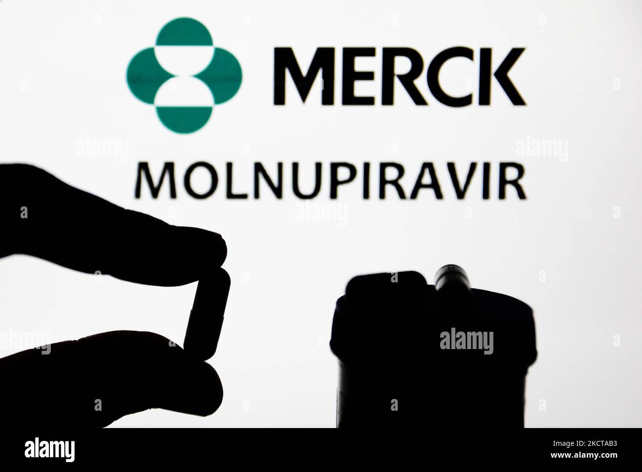 Medicine pill is seen with Merck logo and the wrod 'molnupiravir