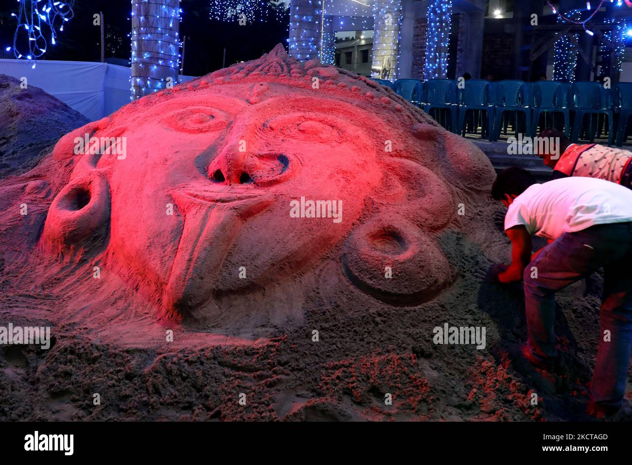 Artists create Goddess Kali with sand near a temple during the celebration of Diwali, the Hindu festival of light in Dhaka, Bangladesh on November 06, 2021. (Photo by Syed Mahamudur Rahman/NurPhoto) Stock Photo