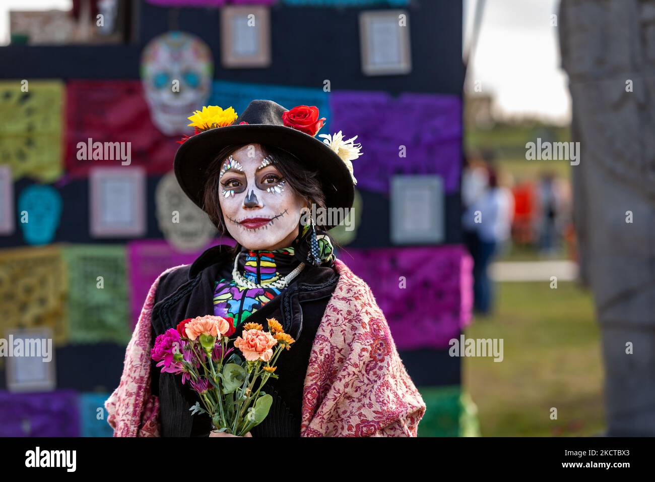 A woman dressed as a Catrina attends the Día de los Muertos benefit and festival on the National Mall. In addition to celebrating the holiday, the festival has two additional purposes: federal recognition of Día de los Muertos as an important cultural day and fundraising for organizations that reunite families separated at the border by US Immigration and Customs Enforcement (ICE). (Photo by Allison Bailey/NurPhoto) Stock Photo