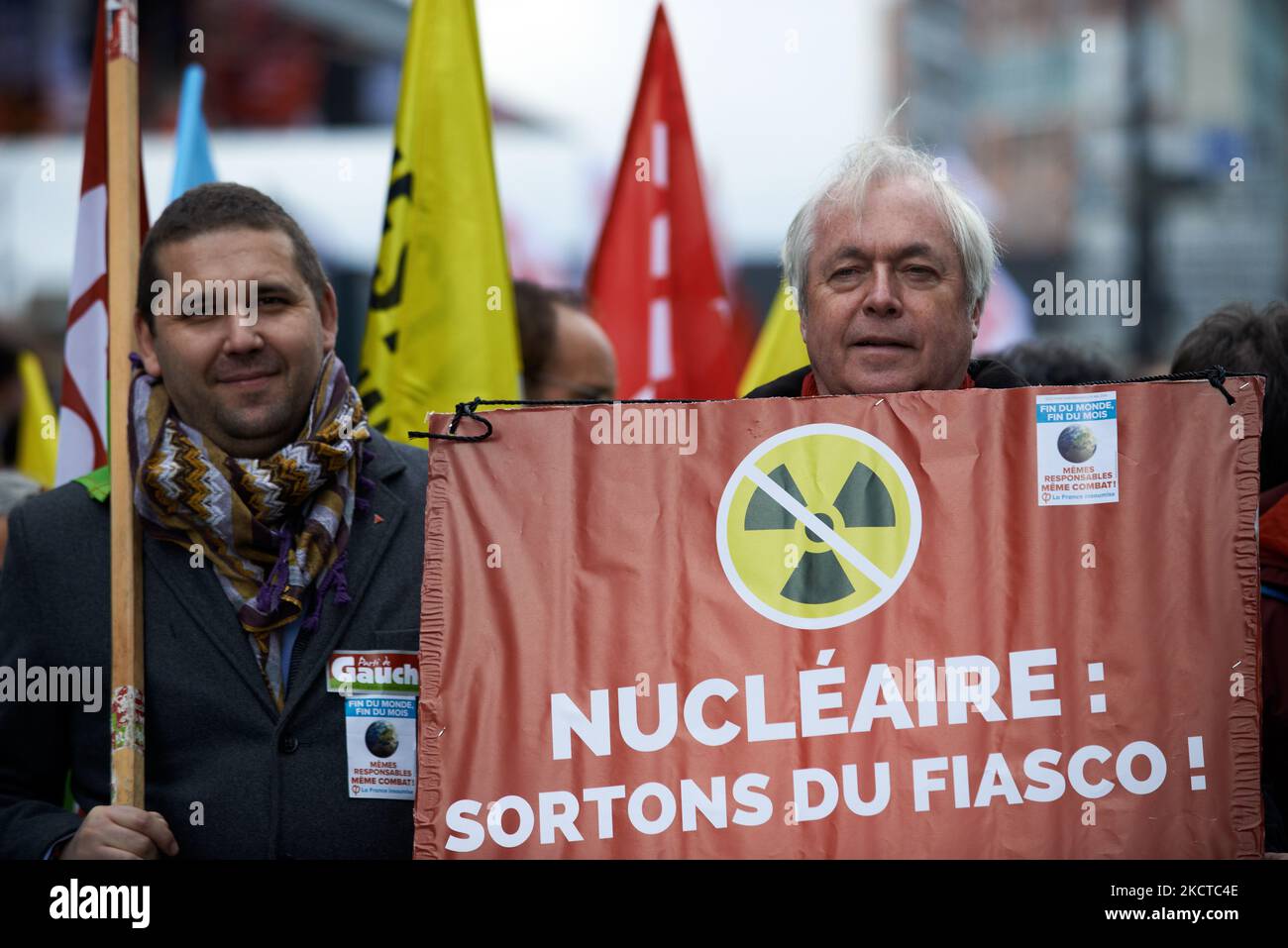 A man holds a placard reading 'Nuclear: let's us get out this fiasco'. More than 3500 people demonstrated in Toulouse for the climate as in many cities across France and across the world. Theses demonstrations were organized as the COP26 has begun in Glasgow (Scotland) to put a maximun pressure on politicians, industries and compagnies. The IPCC paints an unlivable planet if greenhouse emissions continue unabated. The IEA says that fossil fuels must stay in the ground from now (no new mining and drilling). The G20 said in a communique that ''We commit to tackle the existential challenge of cli Stock Photo