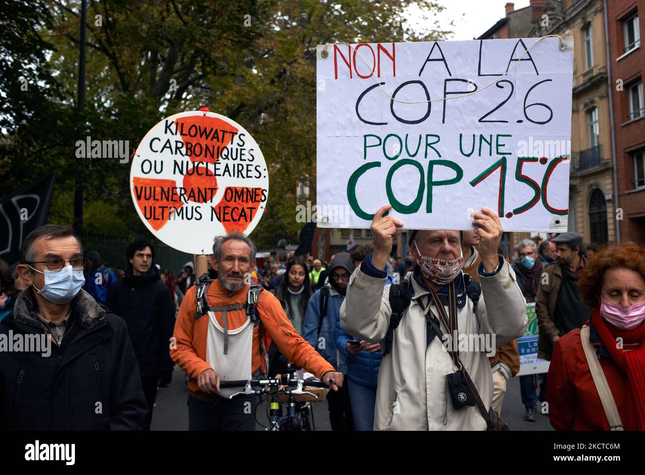 A placardreads 'No to the COP2.6, for a COP1.5°C'. More than 3500 people demonstrated in Toulouse for the climate as in many cities across France and across the world. Theses demonstrations were organized as the COP26 has begun in Glasgow (Scotland) to put a maximun pressure on politicians, industries and compagnies. The IPCC paints an unlivable planet if greenhouse emissions continue unabated. The IEA says that fossil fuels must stay in the ground from now (no new mining and drilling). The G20 said in a communique that ''We commit to tackle the existential challenge of climate change' but sta Stock Photo