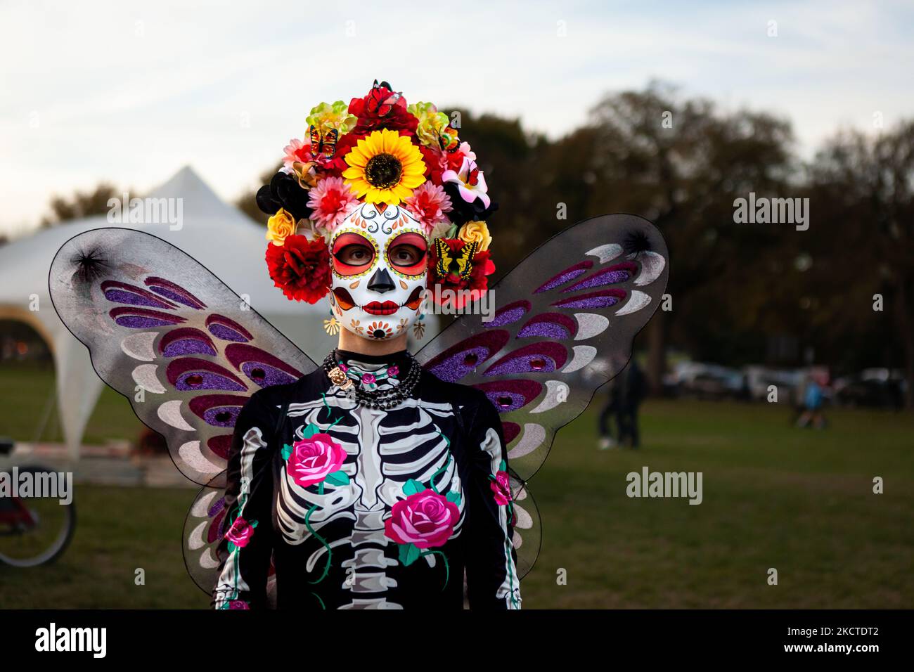 A woman dressed as an elaborate Catrina attends the Día de los Muertos benefit and festival on the National Mall. In addition to celebrating the holiday, the festival has two additional purposes: federal recognition of Día de los Muertos as an important cultural day and fundraising for organizations that reunite families separated at the border by US Immigration and Customs Enforcement (ICE). (Photo by Allison Bailey/NurPhoto) Stock Photo