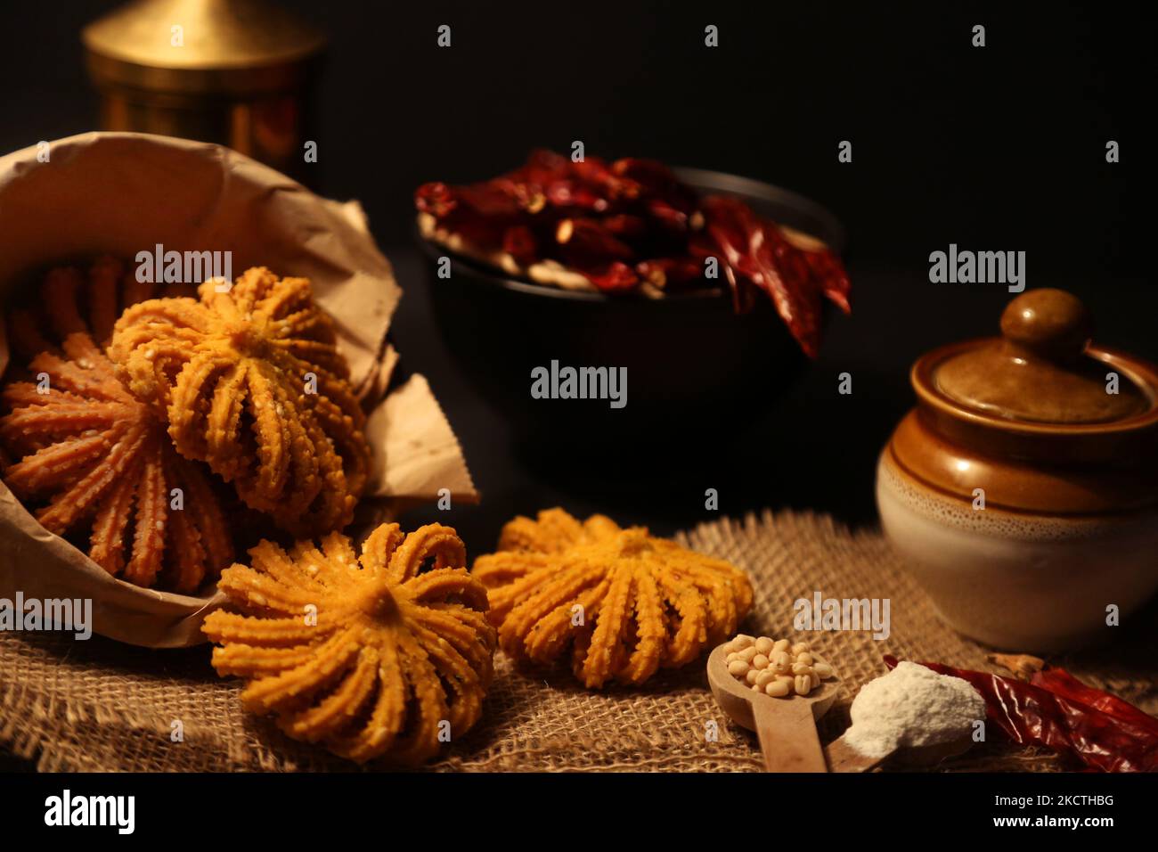 Sri Lankan style Murukku displayed with rice flour, urad dal and red